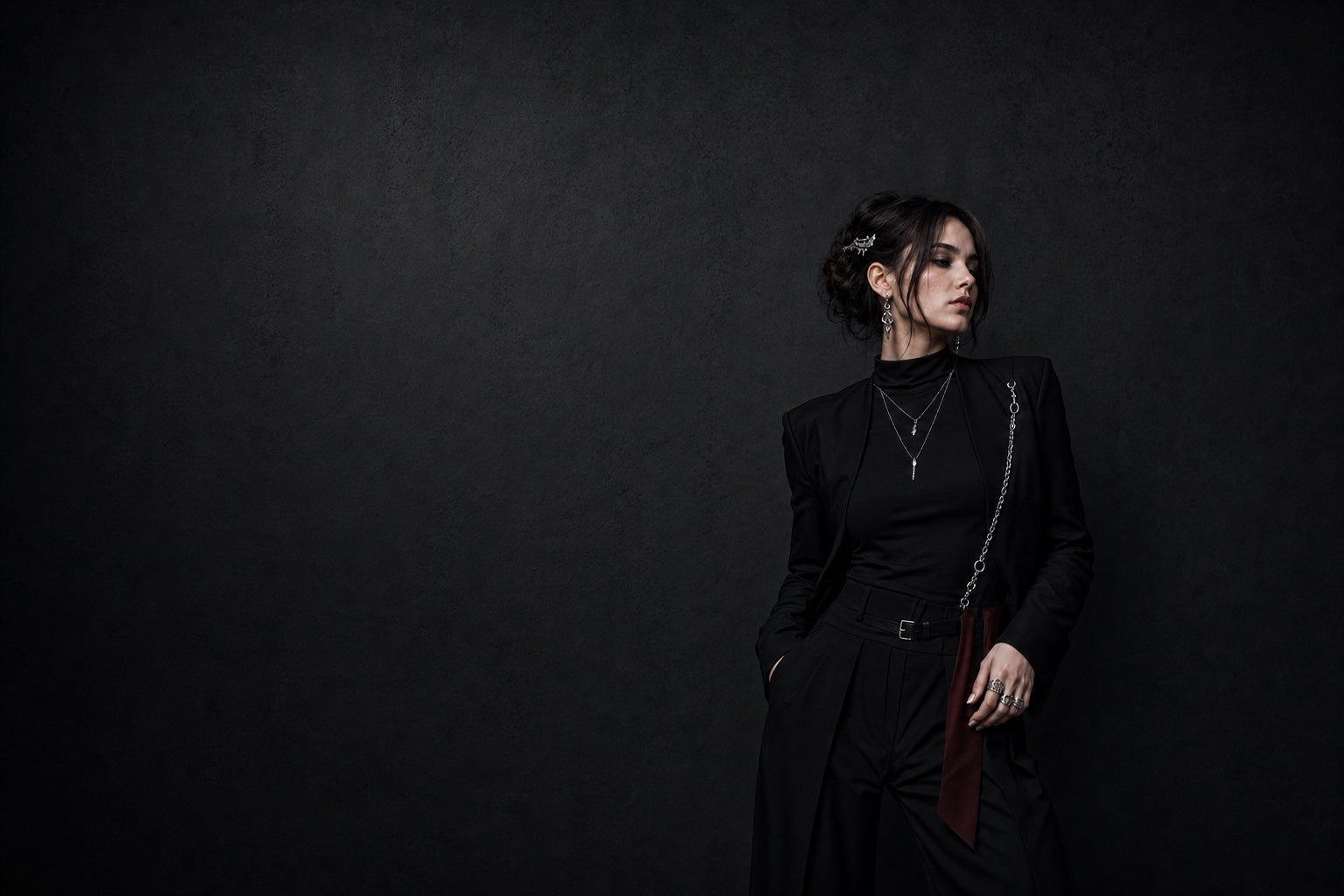 Model wearing balanced YOSLAY earrings, rings, layered necklaces, hair metal and garment chain with desktop header-safe framing