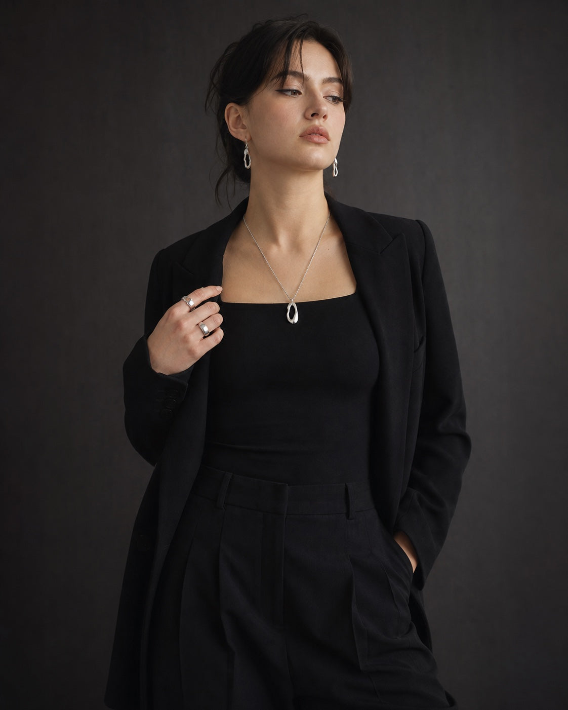 Daily jewelry edit with silver earrings, rings and pendant necklace